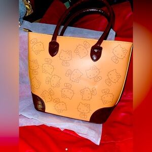 Hello Kitty Yellow and Brown Small Zipper Tote with Dust Bag. NIP